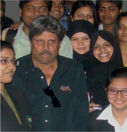 Kapil Dev sharing stage with MBA students at BIBS